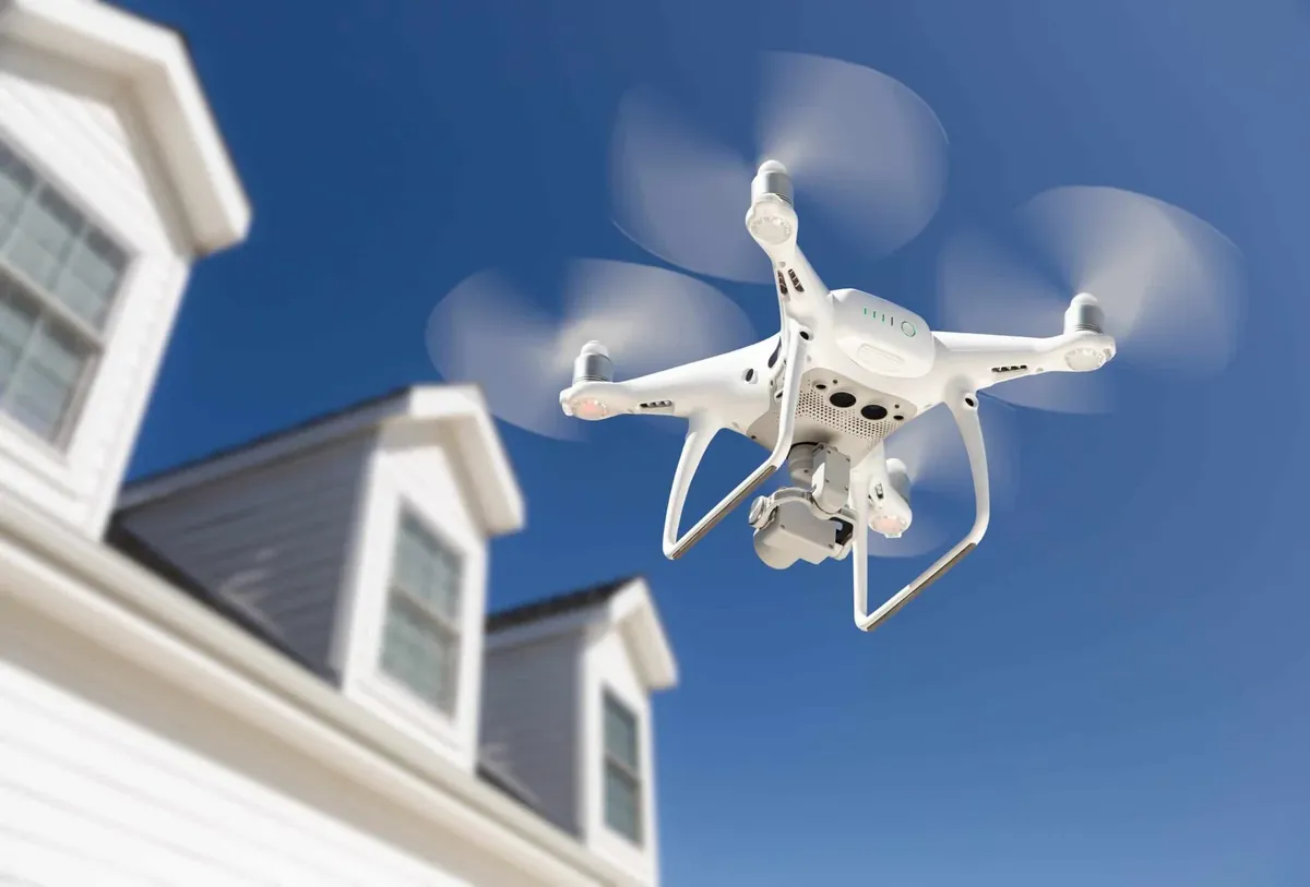 Inspection drone flying over a roof